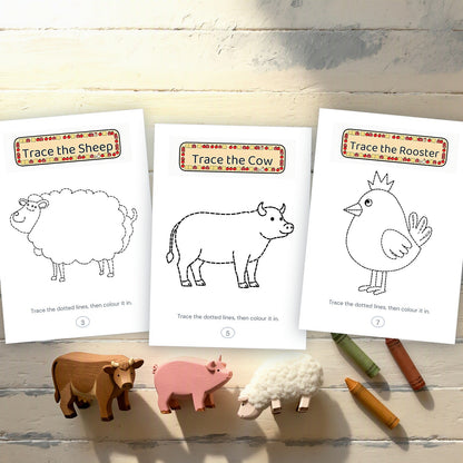 Three printed tracing pages - sheep, cow and rooster - beside wooden farm animal toys