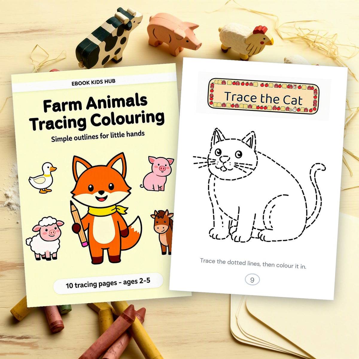 The book cover beside a printed cat tracing page and a stack of blank paper